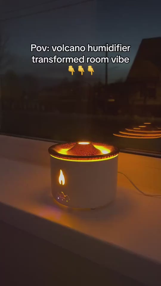 Video of the volcano humidifier puffing mist rings with a flame-effect light